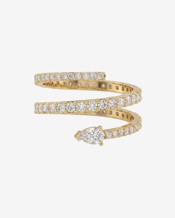 Mostly Fine Billie coil pinky ring with round moissanites graduating in size to a pear moissanite stone at the end in 18K gold vermeil on a white background