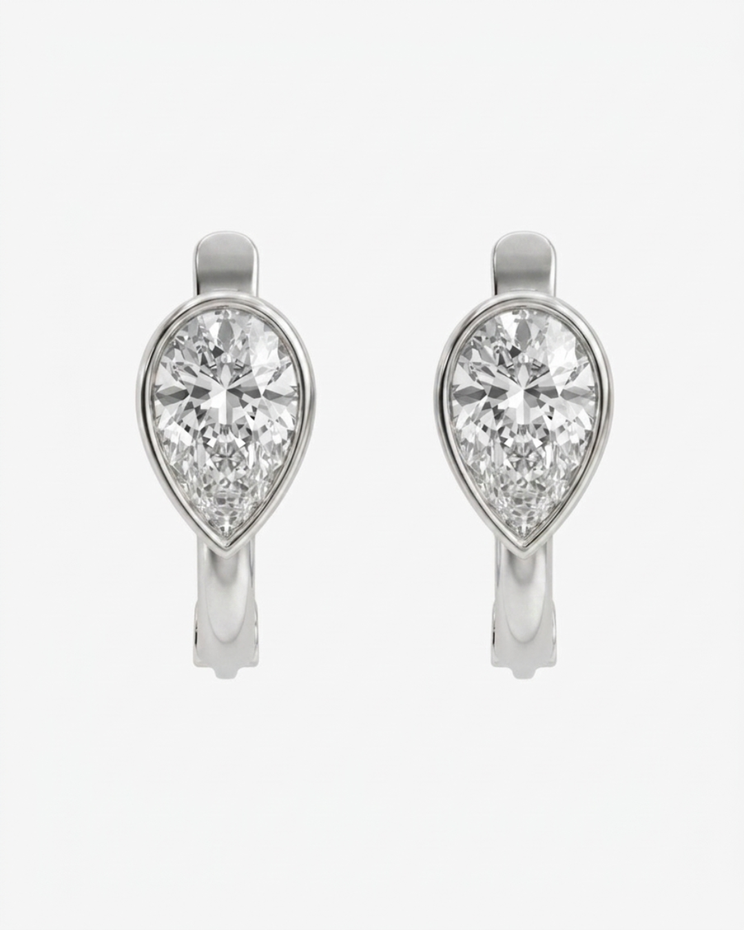 Mostly Fine Pia upside down bezel pear cut moissanite huggies in silver