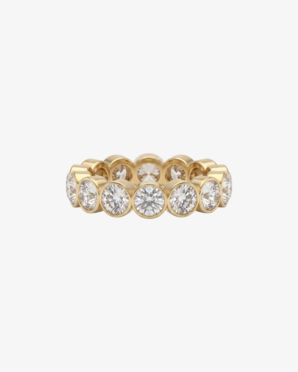 Mostly Fine Sable 4mm round moissanite eternity band ring in 18K gold vermeil on white background